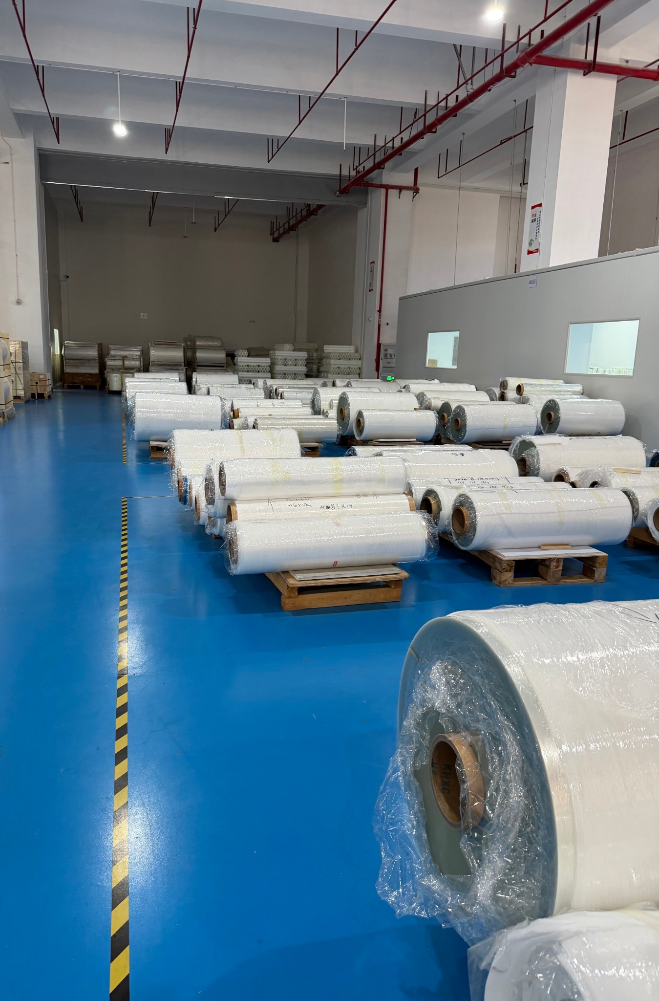Factory warehouse with material rolls